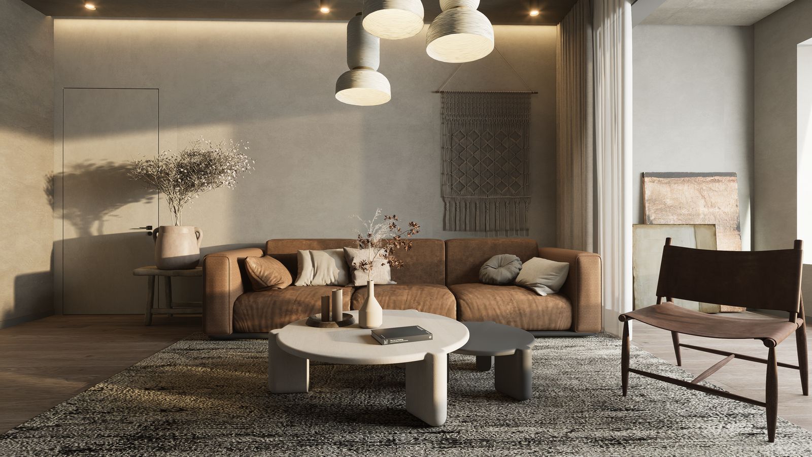 Modern living room styled with a brown sofa, round coffee table, textured rug, and hanging pendant lamps.